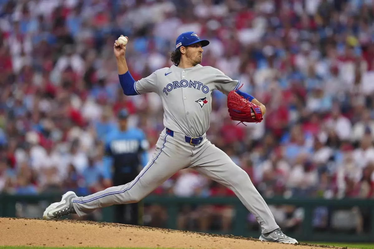 Toronto Blue Jays pitcher Kevin Gausman throws during the third inning of a baseball game against the Philadelphia Phillies, Friday, June 13, 2025, in Philadelphia. (AP Photo/Derik Hamilton)