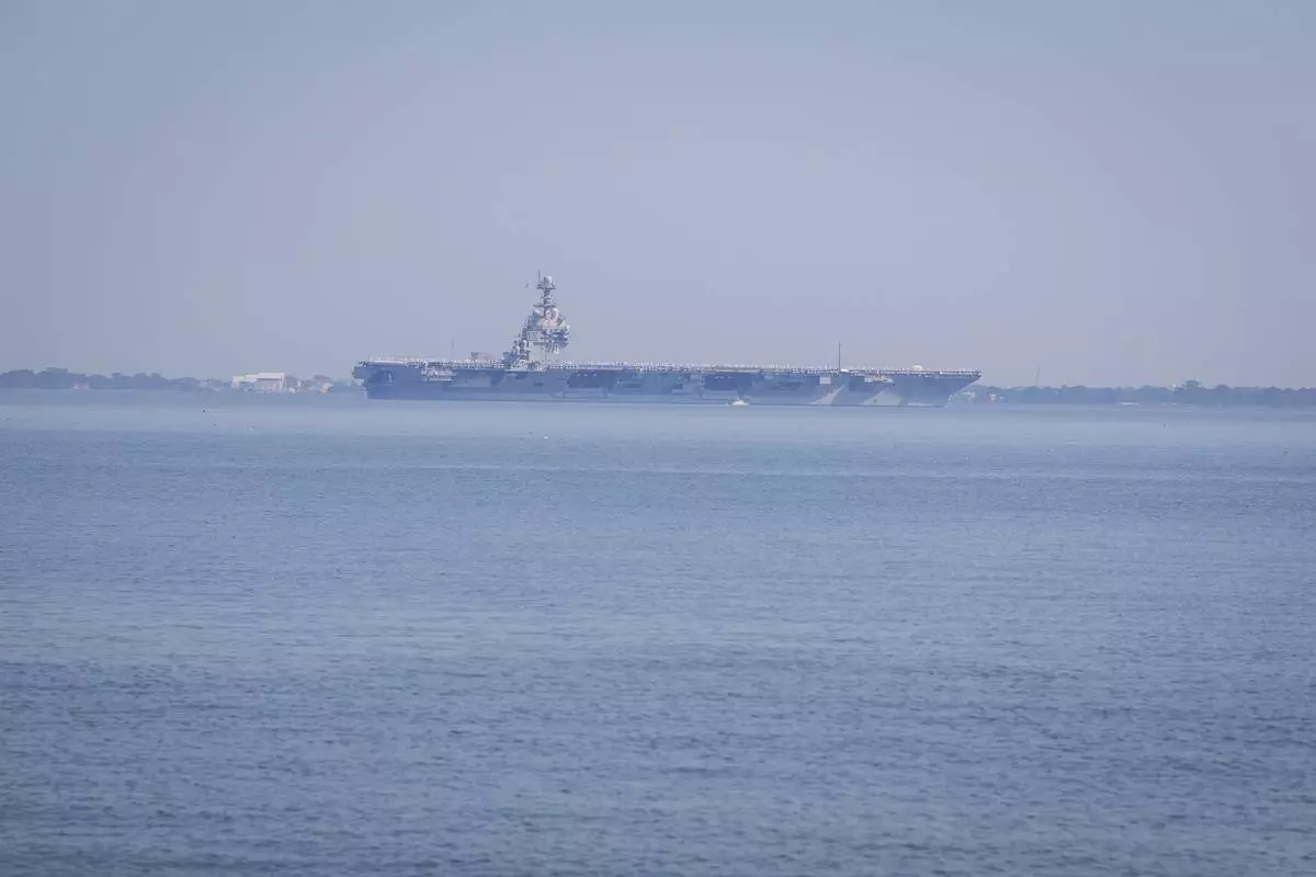 The USS Gerald R. Ford aircraft carrier leaves Naval Station Norfolk, Tuesday, June 24, 2025, in Norfolk, Va. (AP Photo/John Clark)