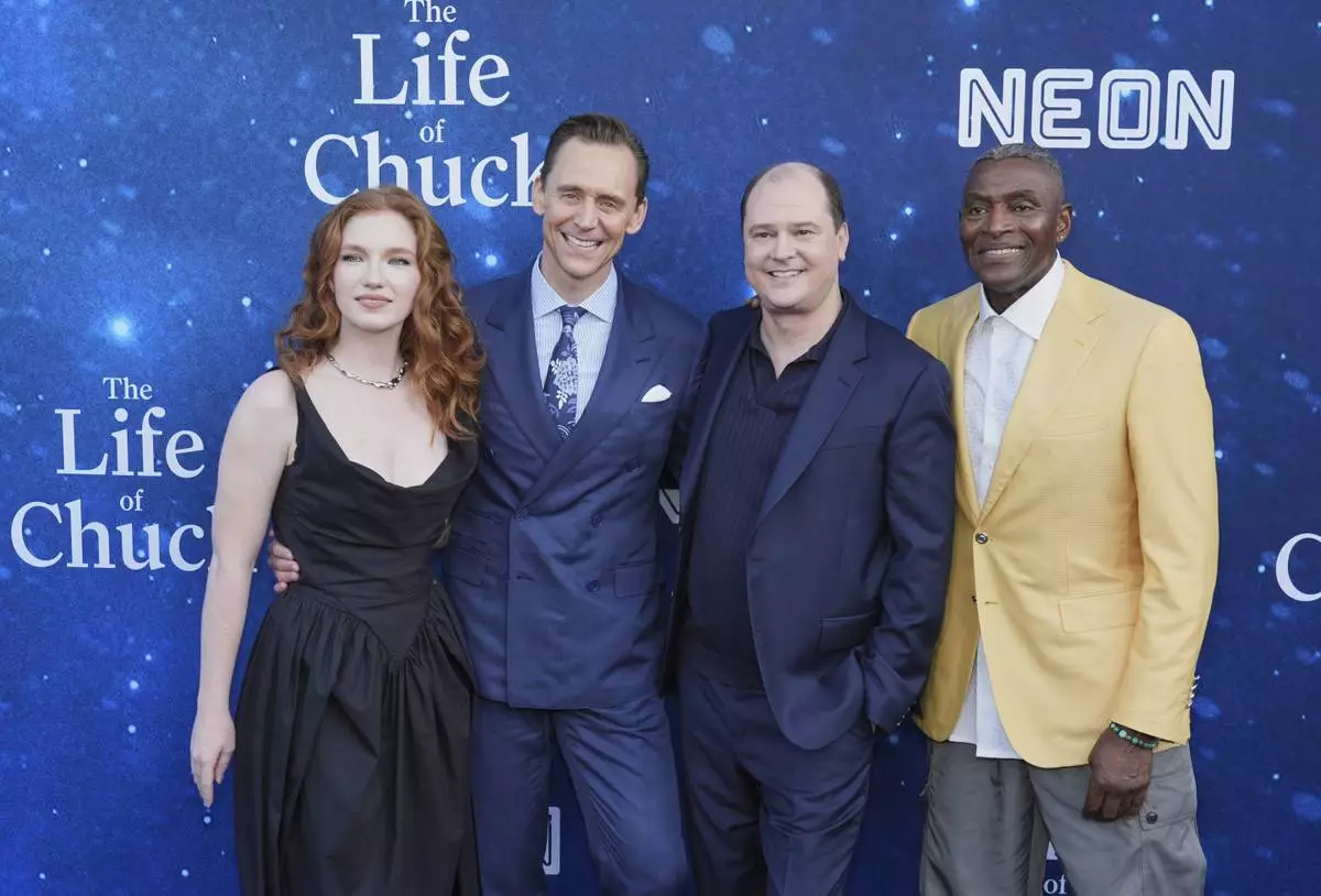 Mike Flanagan, second from right, writer/director of "The Life of Chuck," poses with cast members, from left, Annalise Basso, Tom Hiddleston and Carl Lumbly at the premiere of the film on Monday, June 2, 2025, at Hollywood Legion Theater in Los Angeles. (AP Photo/Chris Pizzello)