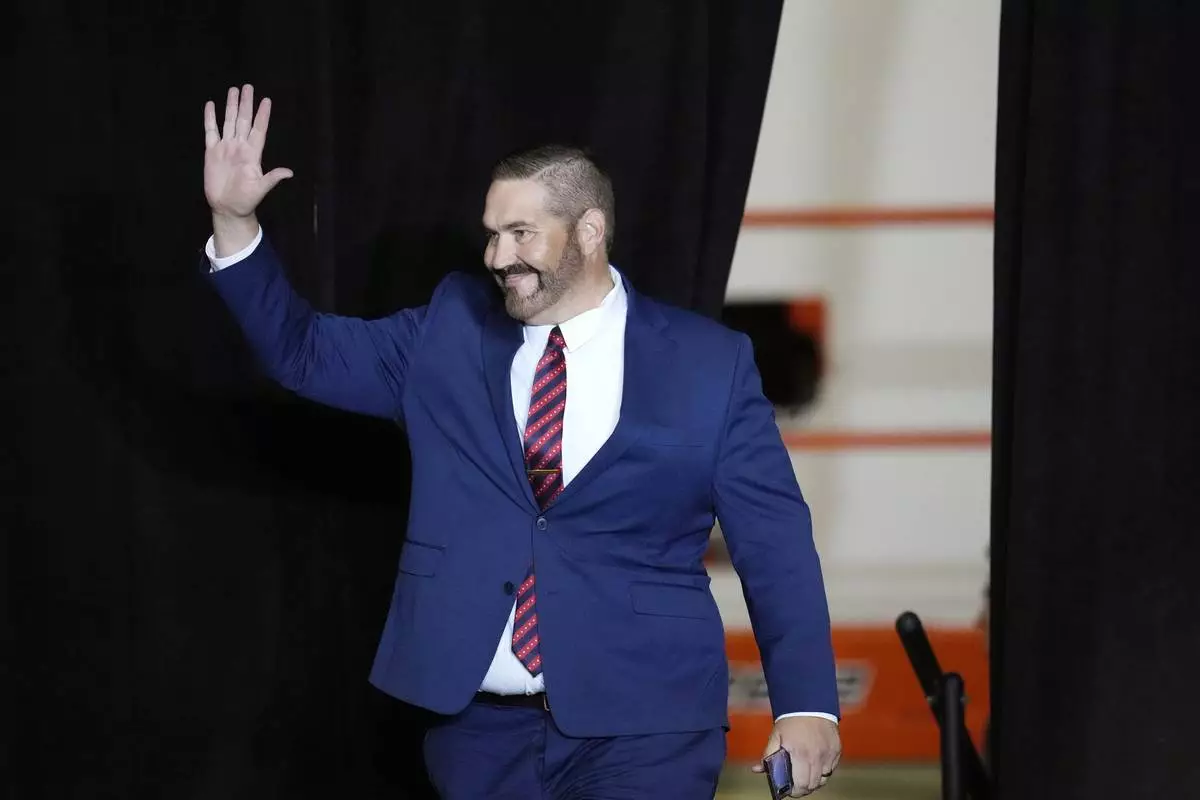 FILE - Maricopa County Recorder candidate and Arizona State Rep. Justin Heap, R-Phoenix, arrives on stage to speak during a campaign event Tuesday, Oct. 22, 2024, in Peoria, Ariz. (AP Photo/Ross D. Franklin, File)