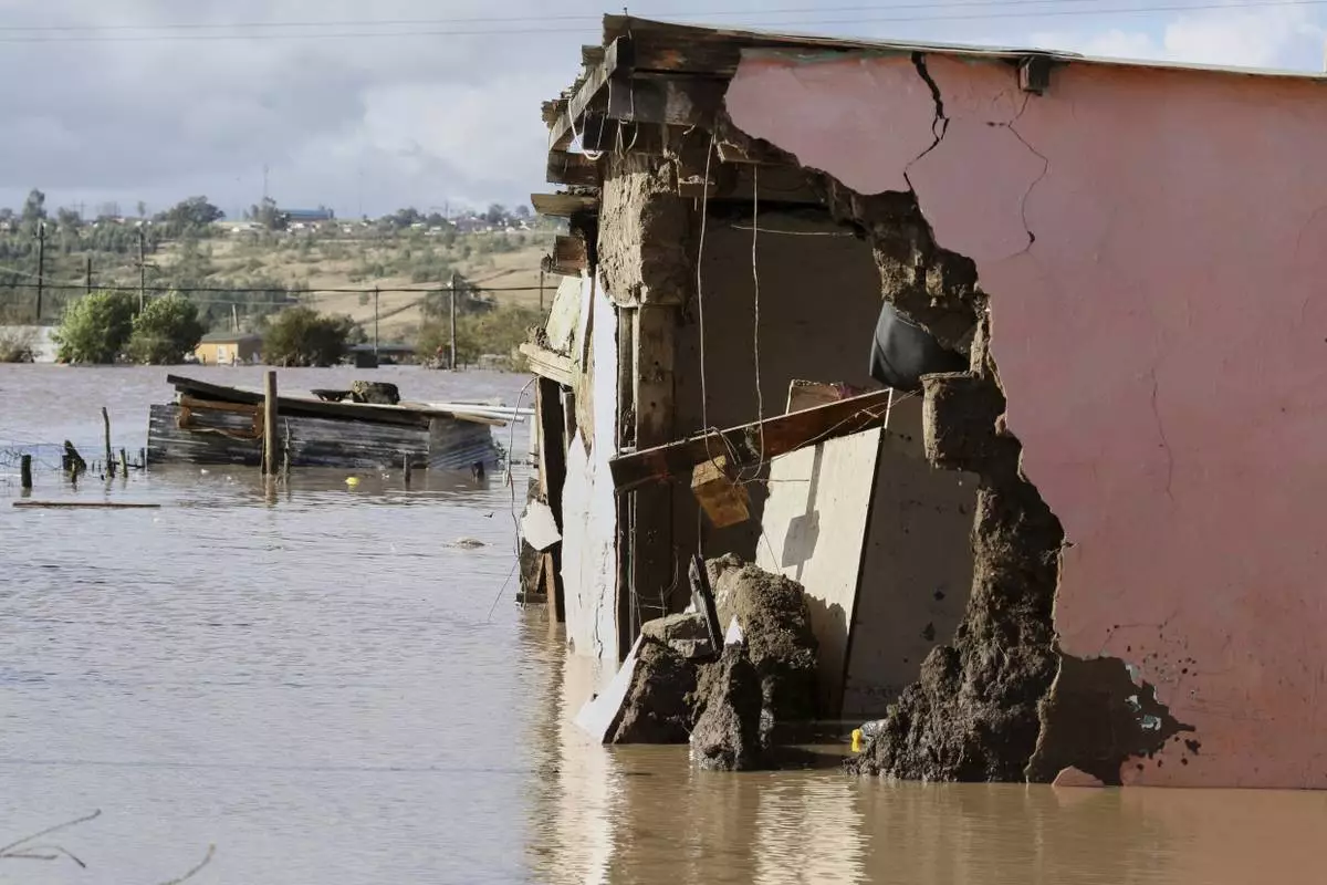 A view of homes submerged in floodwater, in Mthatha, South Africa, Tuesday, June 10, 2025. (AP Photo/Hoseya Jubase)