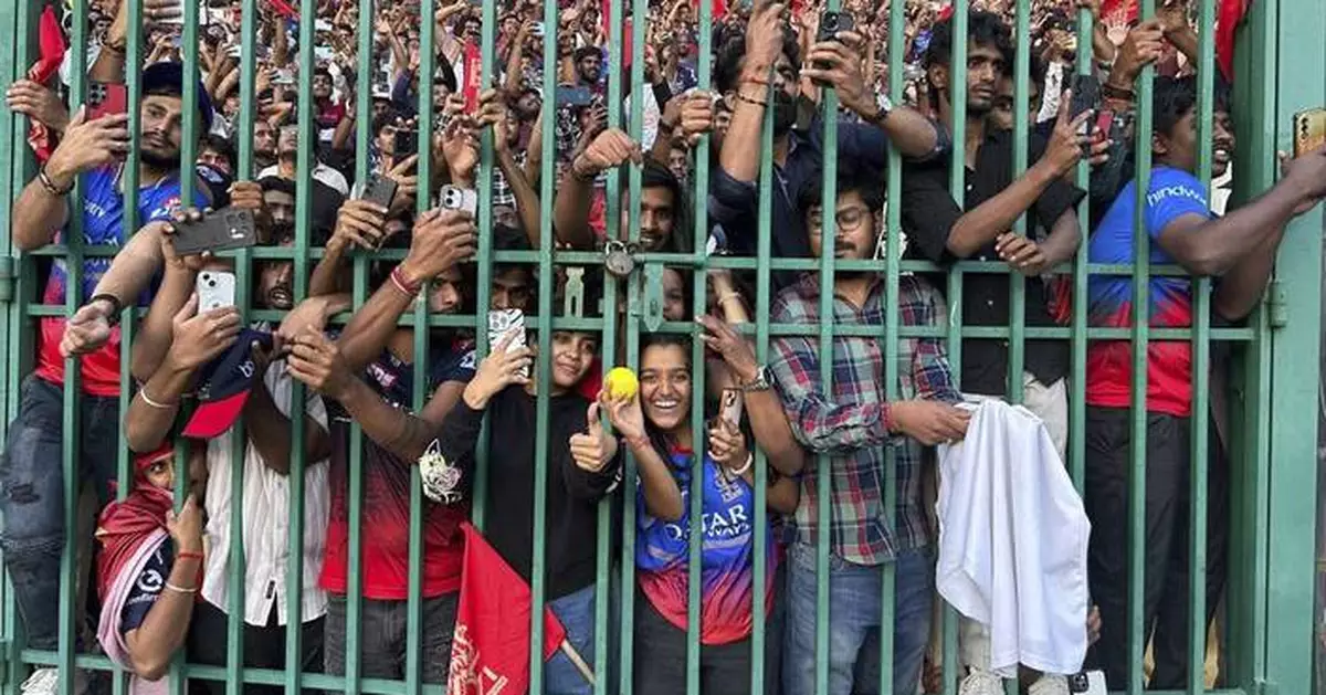 At least 11 people die in a stampede outside a cricket stadium in India after IPL win