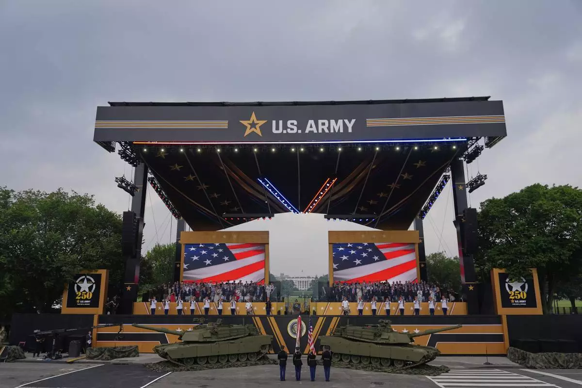 The colors are presented as President Donald Trump attends a military parade commemorating the Army's 250th anniversary, coinciding with his 79th birthday, Saturday, June 14, 2025, in Washington. (AP Photo/Julia Demaree Nikhinson)