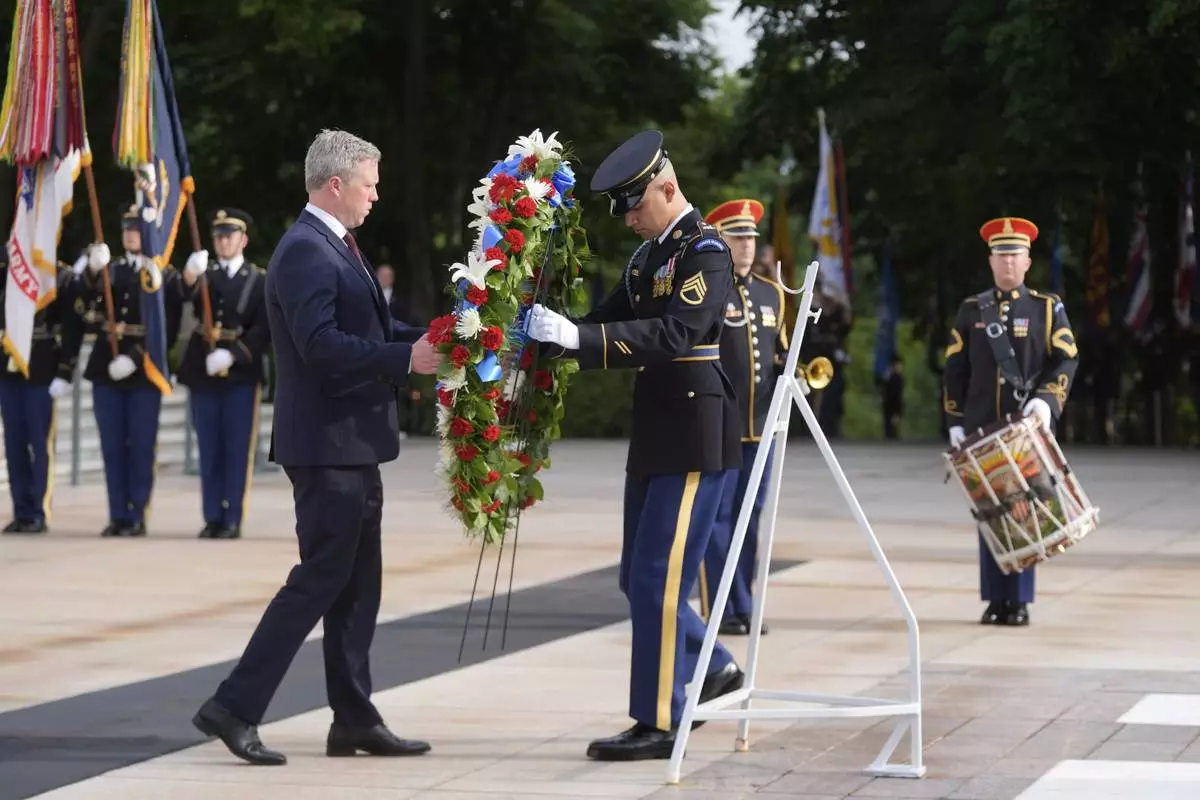 Secretary of the Army Daniel Driscoll lays a wreath at the Tomb of the Unknown Soldier at Arlington National Cemetery, honoring the Army's 250th anniversary and coinciding with President Donald Trump's 79th birthday, Saturday, June 14, 2025, in Arlington, Va. (AP Photo/Manuel Balce Ceneta)