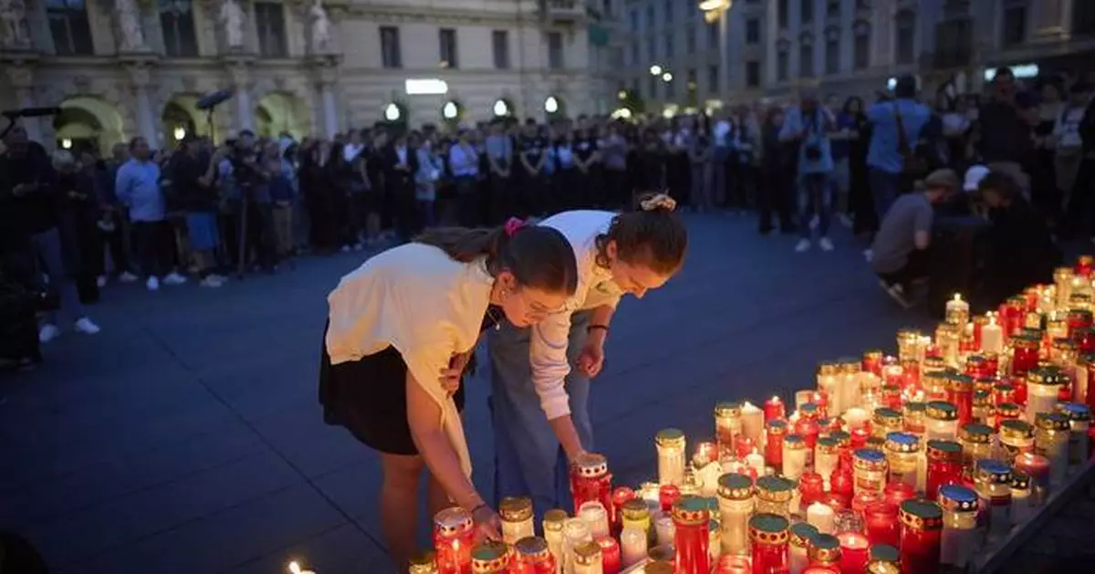 Austria falls silent for a minute as questions remain about the motive for a deadly school shooting