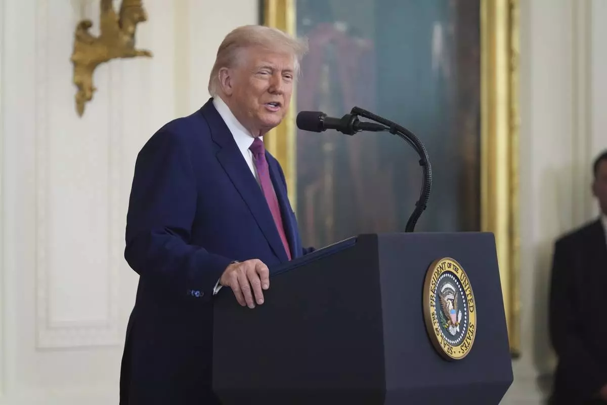 President Donald Trump speaks during an event to sign a bill blocking California's rule banning the sale of new gas-powered cars by 2035 in the East Room of the White House, Thursday, June 12, 2025, in Washington. (AP Photo/Evan Vucci)