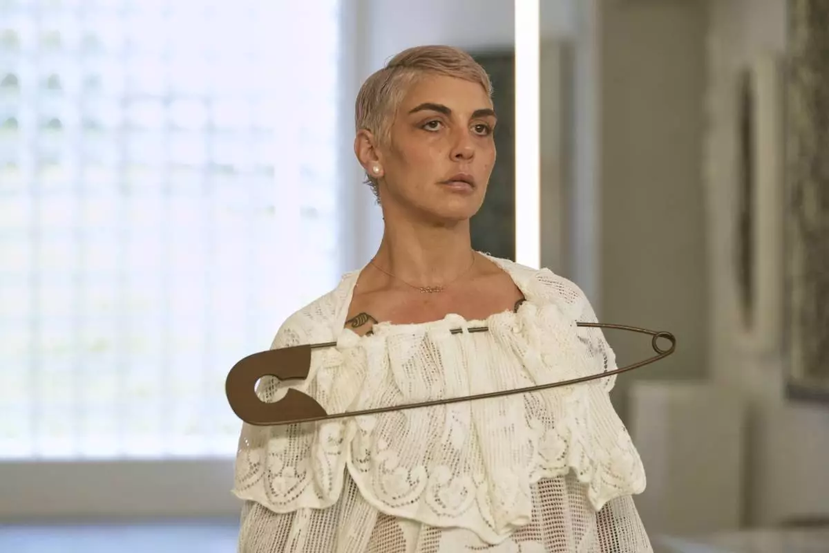 A model wears a creation as part of the men's Simon Cracker Spring-Summer 2026 collection, that was presented in Milan, Italy, Sunday, June 22, 2025. (AP Photo/Luca Bruno)