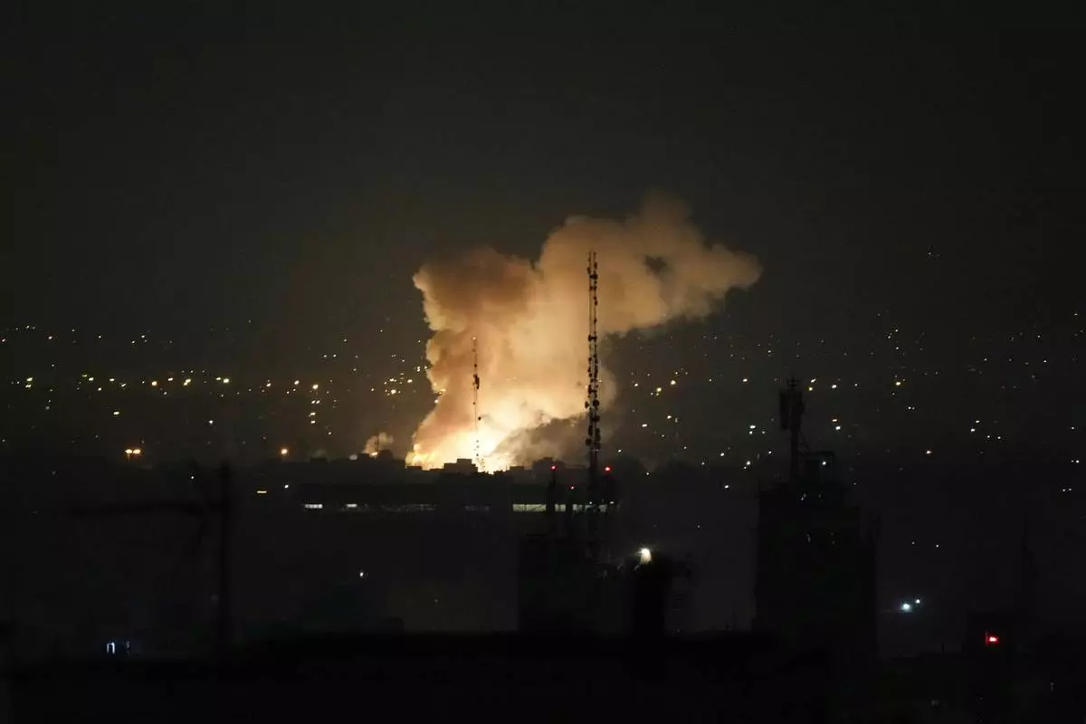 Smoke rises up after an explosion in Tehran, Iran, Friday, June 13, 2025. (AP Photo/Vahid Salemi)