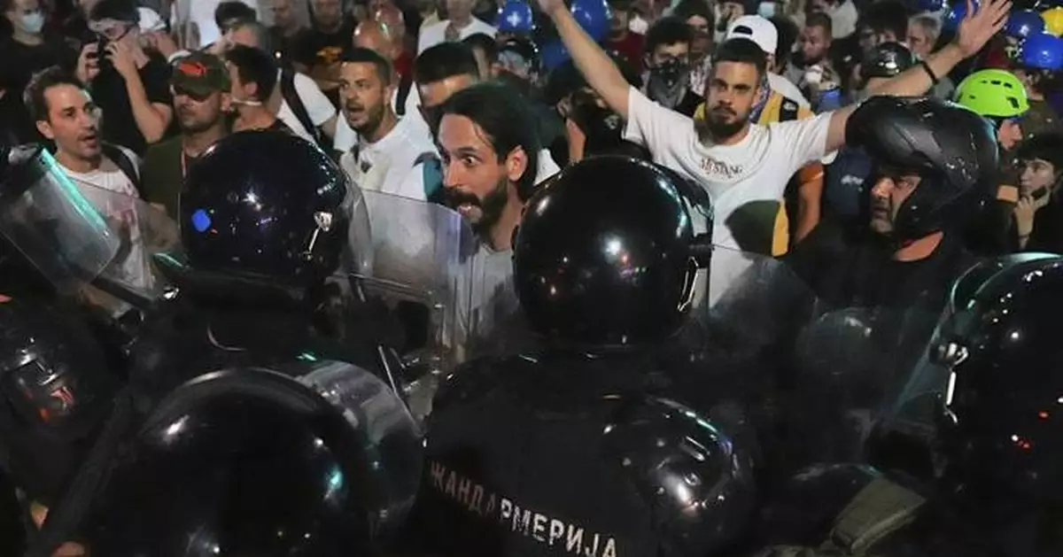 Serbian police remove barricades in Belgrade and make new arrests as protesters block roads