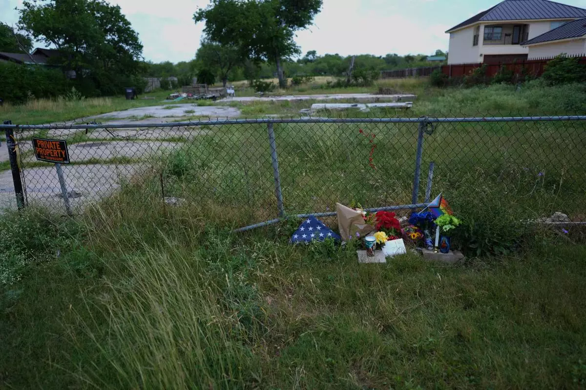 Candles, flowers, and notes make up make-shift memorial for voice actor Jonathan Joss who was recently killed, Tuesday, June 3, 2025, in San Antonio. (AP Photo/Eric Gay)