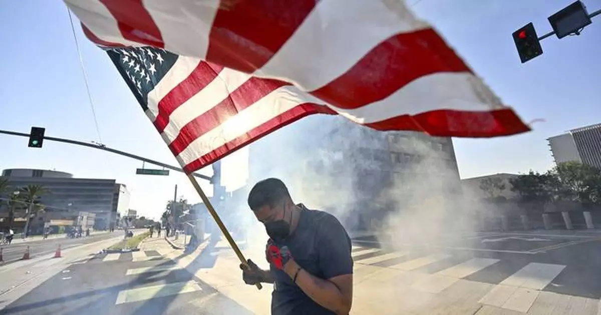 AP PHOTOS: Protests over immigration raids spread beyond Los Angeles