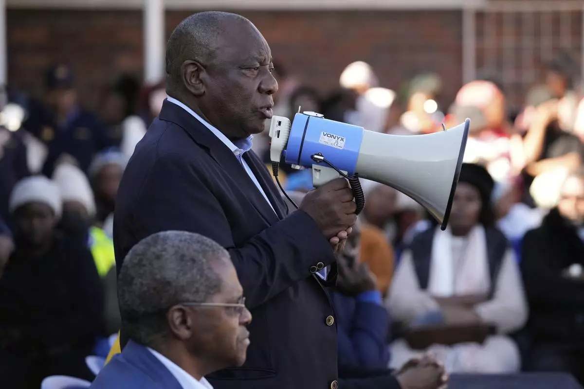 South African President Cyril Ramaphosa addresses victims of this week's floods in Mthatha, South Africa, Friday, June 13, 2025. (AP Photo/Themba Hadebe)