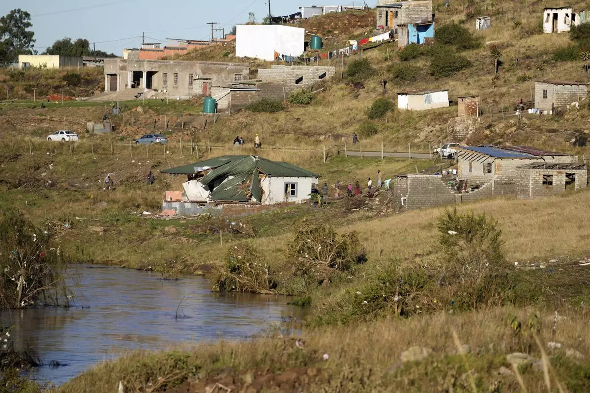 Homes sit damaged after floods swept through the area in Mthatha, South Africa, Thursday, June 12, 2025. (AP Photo/Themba Hadebe)