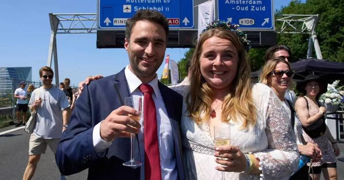 Couples tie the knot during a festival on an Amsterdam ring road