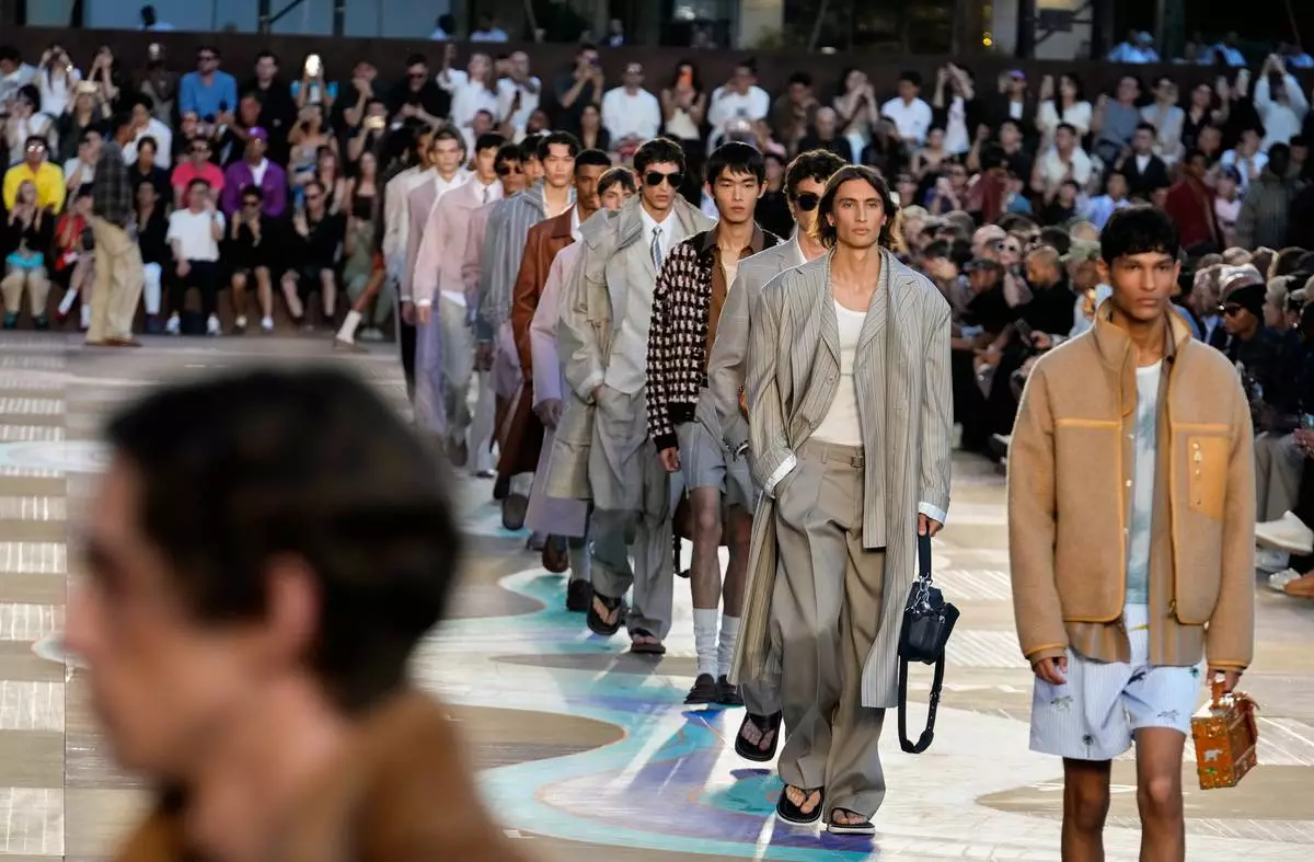 Models wear creations as part of the men's Louis Vuitton Spring-Summer 2026 collection, that was presented in Paris, Tuesday, June 24, 2025. (AP Photo/Michel Euler)