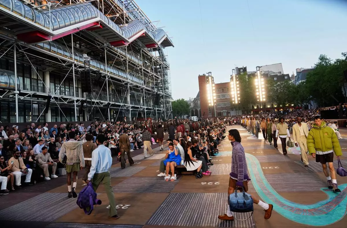 Models wear creations as part of the men's Louis Vuitton Spring-Summer 2026 collection, that was presented in Paris, Tuesday, June 24, 2025. (AP Photo/Michel Euler)