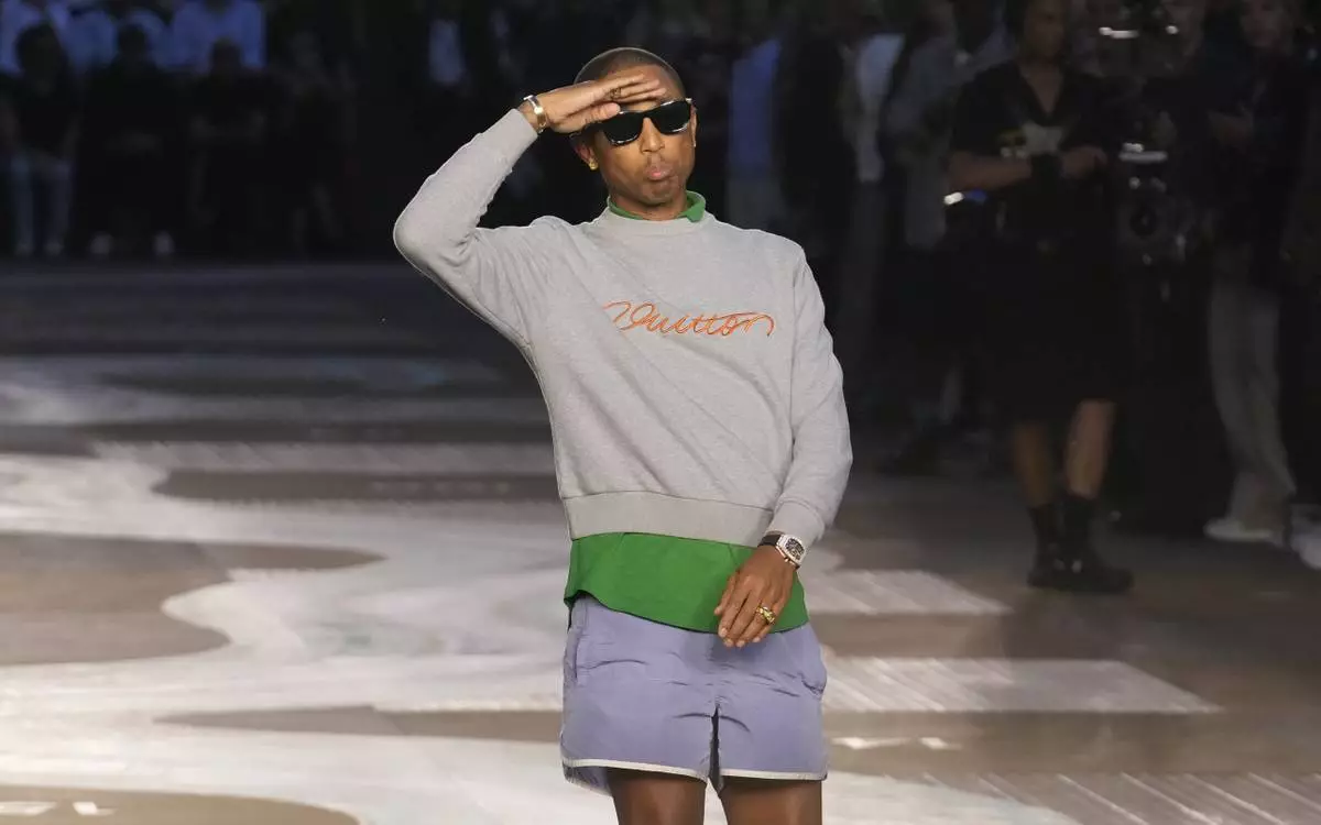 Designer Pharrell Williams takes the stage after the men's Louis Vuitton Spring-Summer 2026 collection, that was presented in Paris, Tuesday, June 24, 2025. (AP Photo/Michel Euler)
