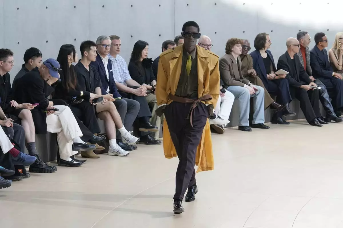 A model wears a creation as part of the men's Saint Laurent Spring-Summer 2026 collection, that was presented in Paris, Tuesday, June 24, 2025. (AP Photo/Michel Euler)