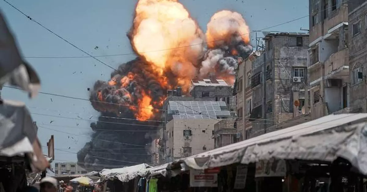 AP PHOTOS: An AP photographer captures the moment an Israeli airstrike slammed into Gaza City