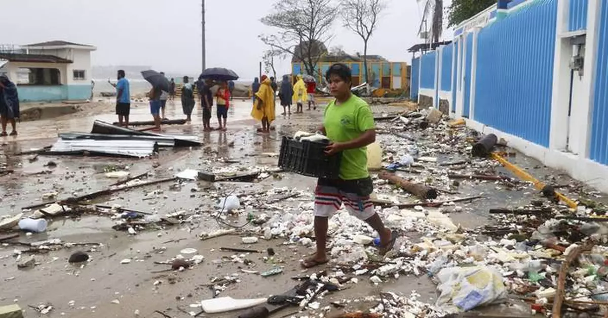 Mexico assesses damage from Hurricane Erick as rising rivers leave at least 1 dead