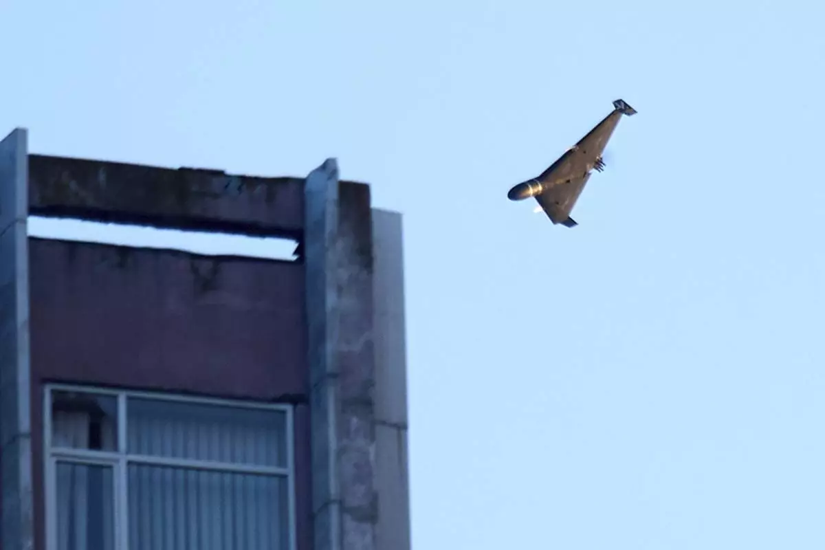A Russian drone attacks a building during Russia's massive missile and drone air attack in Kyiv, Ukraine, Tuesday, June 17, 2025. (AP Photo/Efrem Lukatsky)