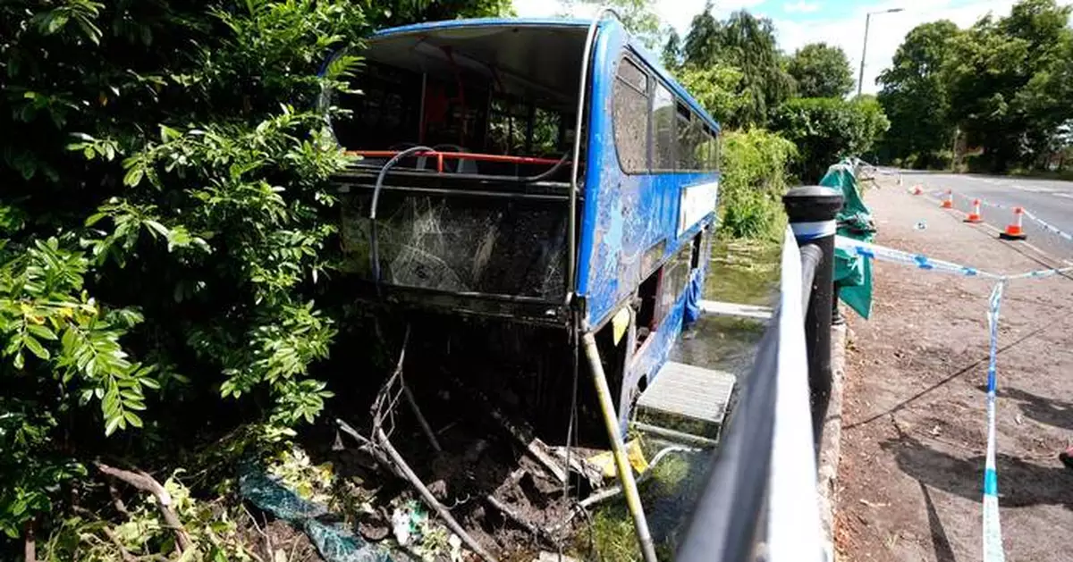 Double-decker bus carrying students plunges into river in England in 'terrifying' crash