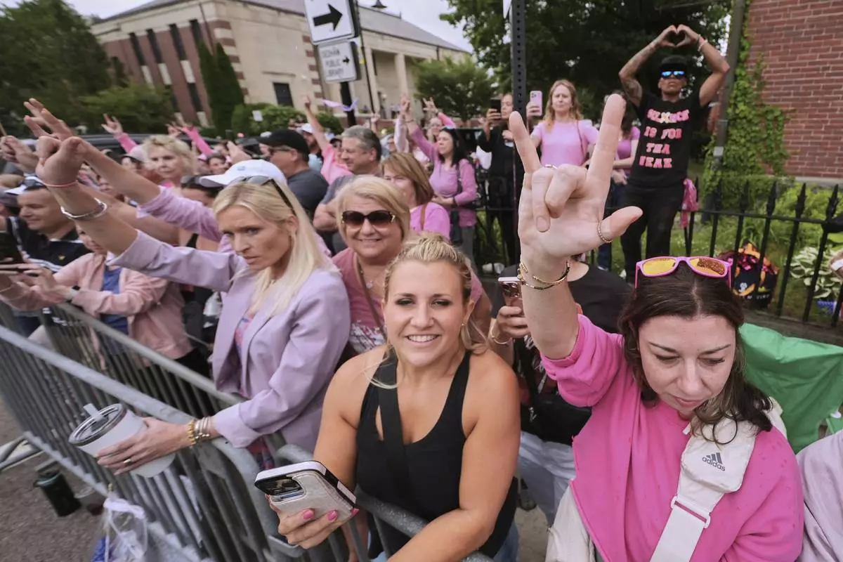 Supporters of Karen Read gesture as Read departs Norfolk Superior Court for the day during jury deliberations at her trial, Tuesday, June 17, 2025, in Dedham, Mass. (AP Photo/Charles Krupa)