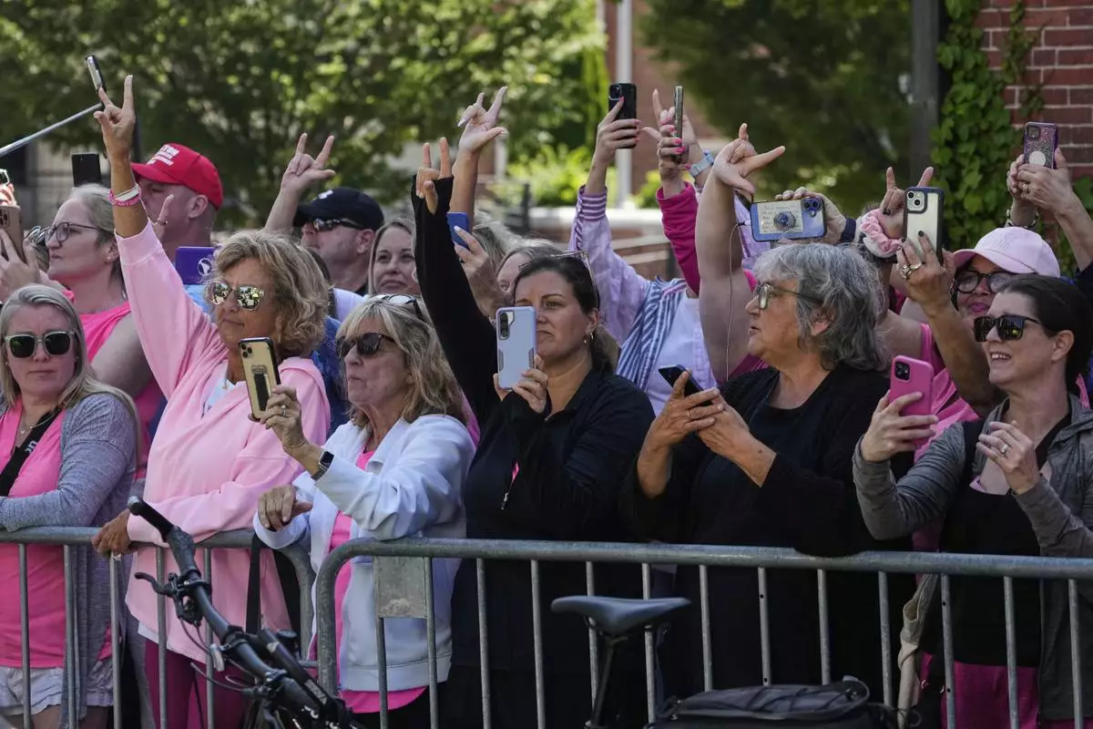Supporters signal to Karen Read, as the jury deliberates at Read's trial, outside Norfolk Superior Court, Monday, June 16, 2025, in Dedham, Mass. (AP Photo/Charles Krupa)