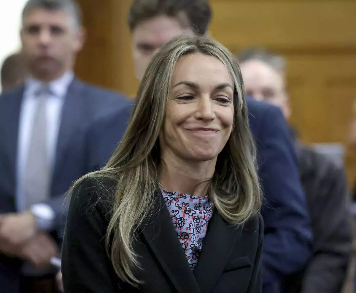 Defendant Karen Read smiles before closing arguments during her murder trial in Norfolk Superior Court, Friday, June 13, 2025, in Dedham, Mass. (Mark Stockwell/The Sun Chronicle via AP, Pool)
