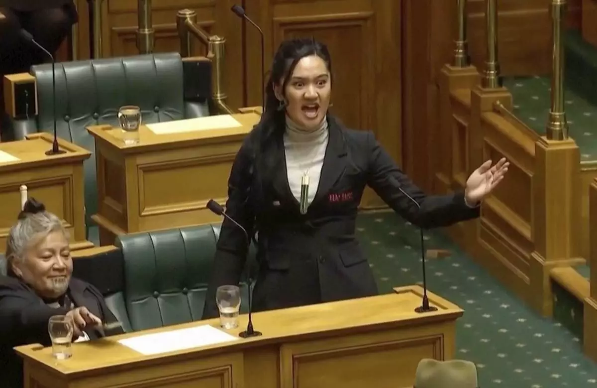 CORRECTS DATE TO NOV. 14, 2024, NOT MAY 15, 2025 - In this image from video provided by the New Zealand Parliament TV, lawmaker Hana-Rāwhiti Maipi-Clarke performs a Māori haka to protest a proposed law during a session of Parliament in Wellington, New Zealand, on Nov. 14, 2024, (New Zealand Parliament TV via AP)