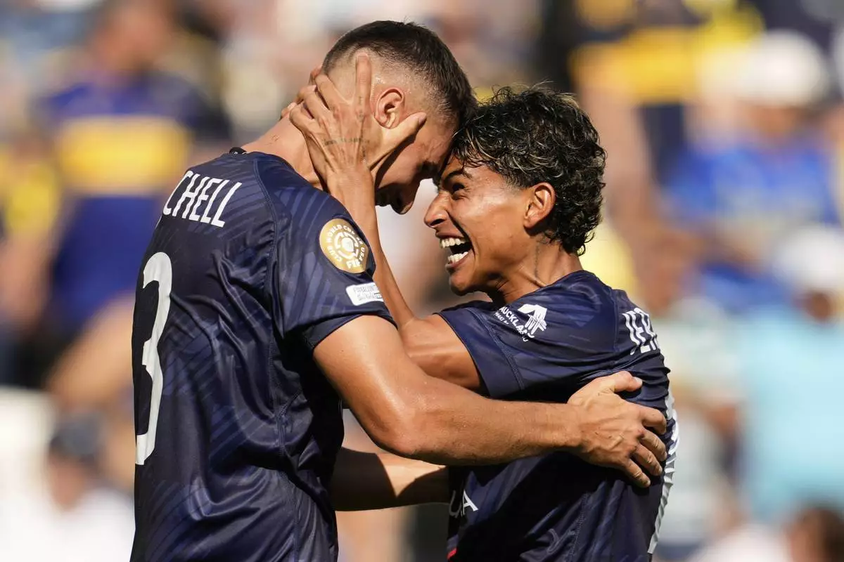 Auckland City's Adam Mitchell, left, and Jerson Lagos celebrate after the Club World Cup Group C soccer match between Auckland City and Boca Juniors in Nashville, Tenn., Tuesday, June 24, 2025. (AP Photo/George Walker IV)