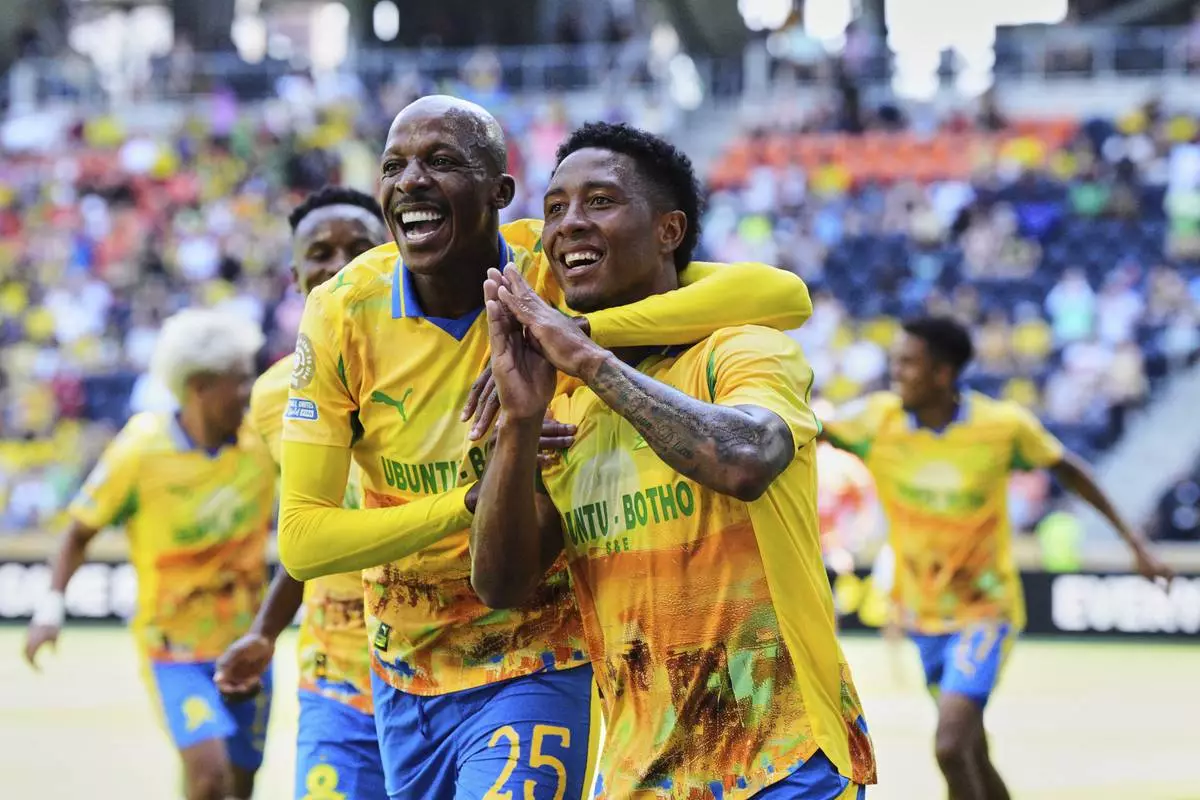 Mamelodi Sundowns' Khuliso Mudau, left, and Lucas Ribeiro Costa celebrate after a goal during the Club World Cup Group F soccer match between Mamelodi Sundowns and Borussia Dortmund in Cincinnati, Saturday, June 21, 2025. (AP Photo/Jeff Dean)