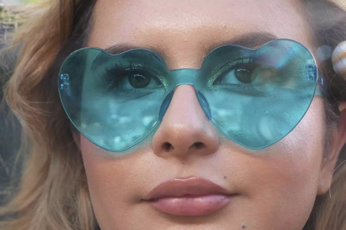 Bella Bautista, 22, a trans woman, attends a concert during World Pride, Saturday, June 7, 2025, on the National Mall in Washington. (AP Photo/Jacquelyn Martin)