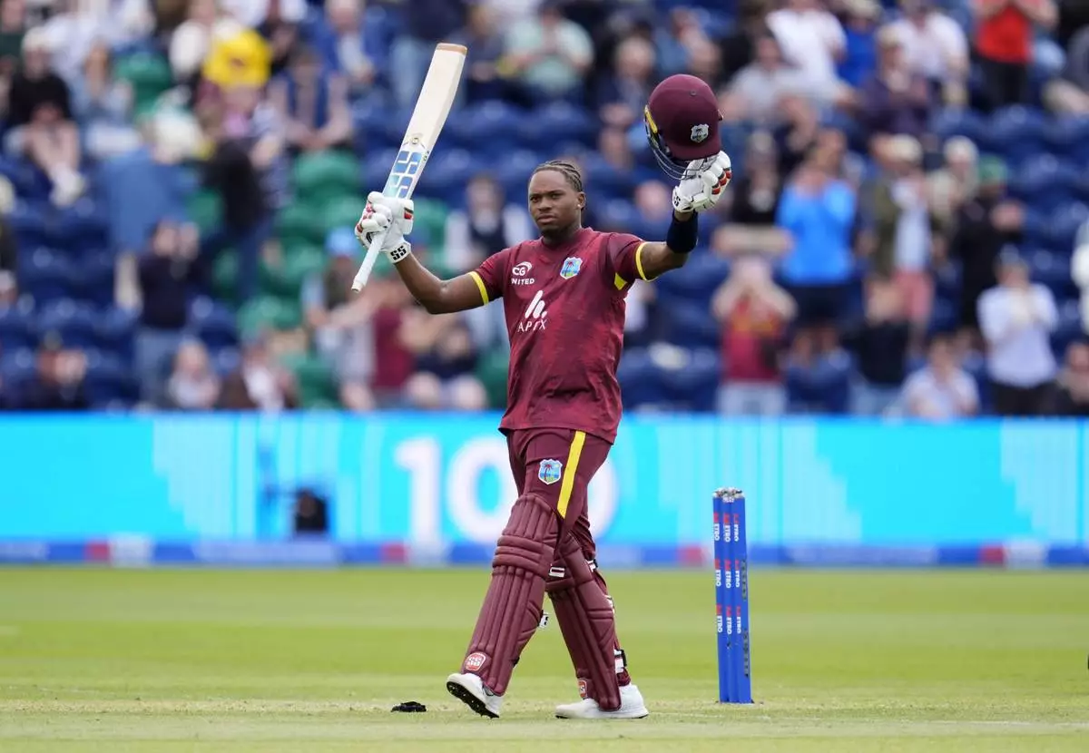 West Indies' Keacy Carty celebrates after scoring his hundred during the Second Men's One Day International cricket match against England at Sophia Gardens, Cardiff, Wales, Sunday, June 1, 2025. (Nick Potts/PA via AP)