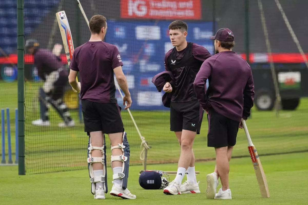 England's Harry Brook, left, Matthew Potts, center, and head coach Brendon McCullum attend a nets session at Sophia Gardens, Cardiff, Wales, Saturday May 31, 2025. (Nick Potts/PA via AP)