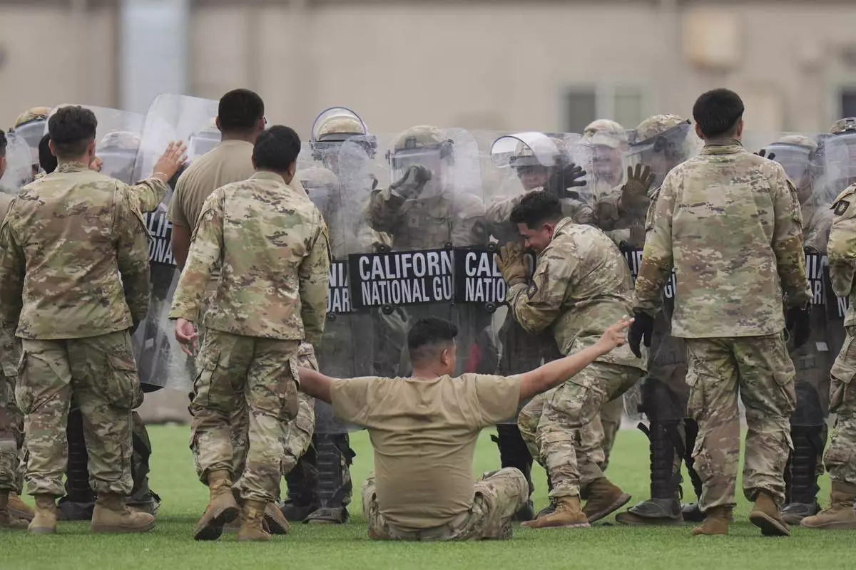 Members of the California National Guard conduct exercises after being deployed to the Los Angeles protests Wednesday, June 11, 2025, in Los Alamitos, Calif. (AP Photo/Jae C. Hong)