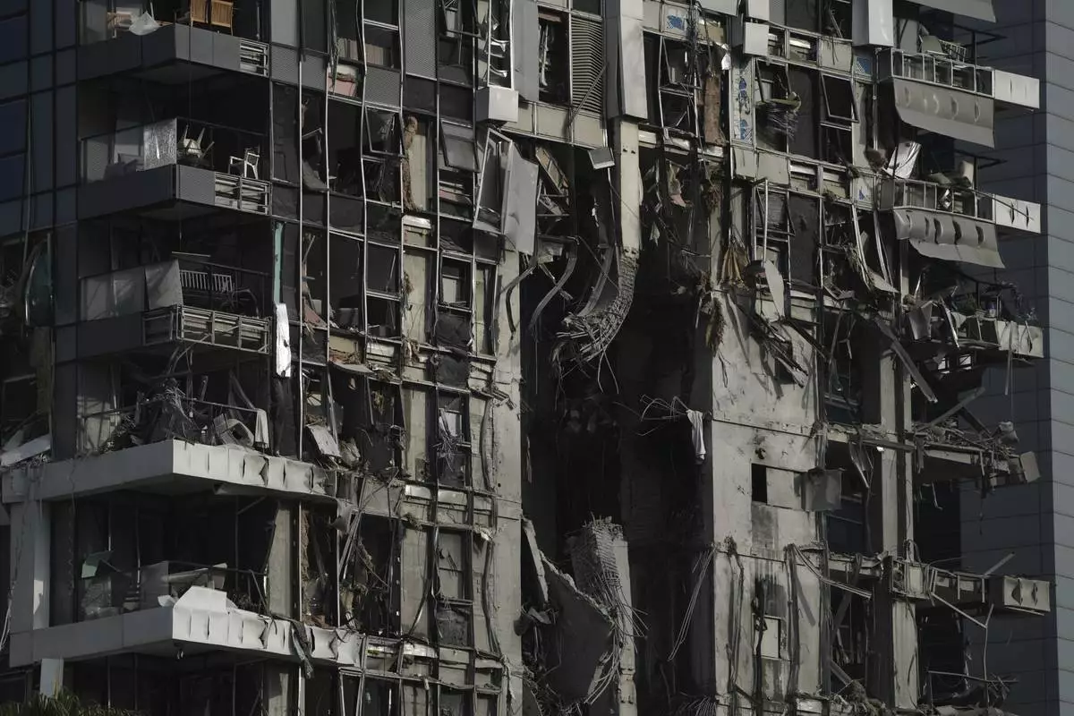 A residential building that was struck by a missile fired from Iran, is seen in Tel Aviv, Israel, on Saturday, June 14, 2025. (AP Photo/Leo Correa)