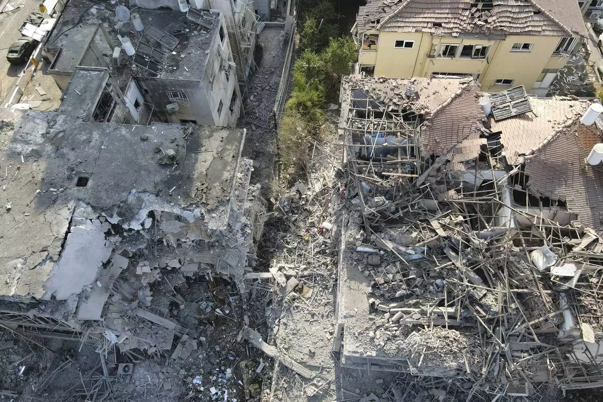 Destroyed residential buildings that was hit by a missile fired from Iran is seen in Ramat Gan, near Tel Aviv, Israel on Saturday, June 14, 2025. (AP Photo/Ariel Schalit)