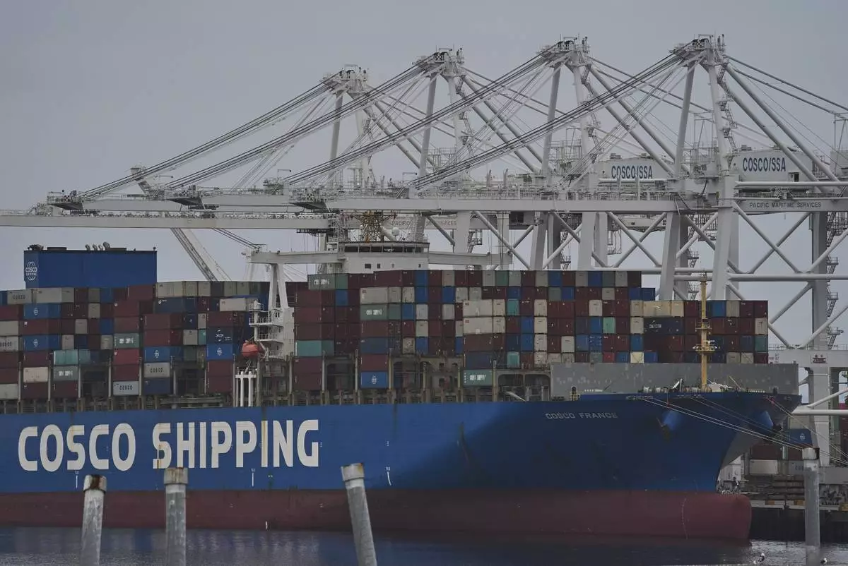 FILE -The "Cosco Shipping France" container ship is moored at the Long Beach Container Terminal, LBCT, at Middle Harbor in the Port of Long Beach, Calif., , April 15, 2025. (AP Photo/Damian Dovarganes, File)