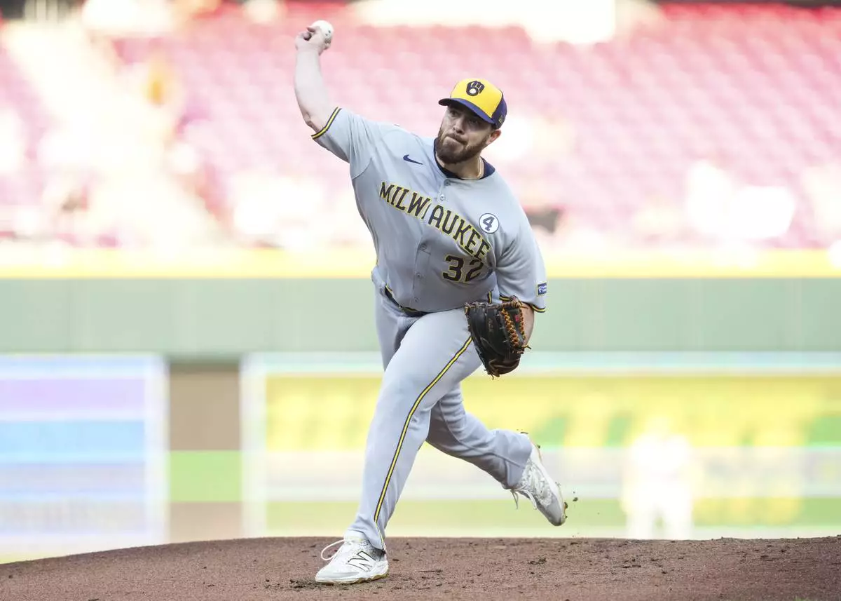 Milwaukee Brewers pitcher Aaron Civale throws during the first inning of a baseball game against the Cincinnati Reds, Monday, June 2, 2025, in Cincinnati. (AP Photo/Jeff Dean)