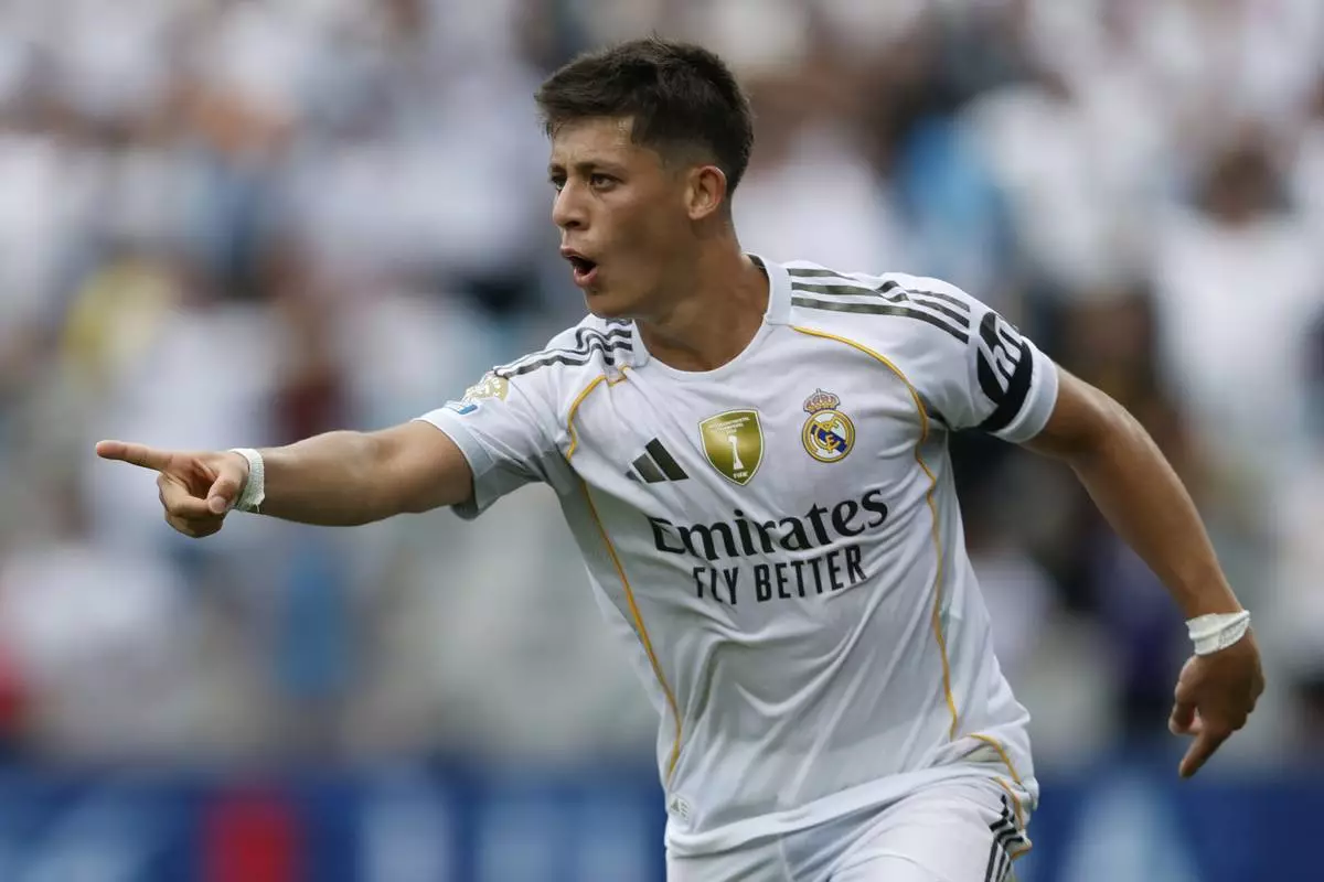 Real Madrid's Arda Guler celebrates after scoring during the Club World Cup Group H soccer match between Real Madrid and CF Pachuca in Charlotte, N.C., Sunday, June 22, 2025. (AP Photo/Nell Redmond)