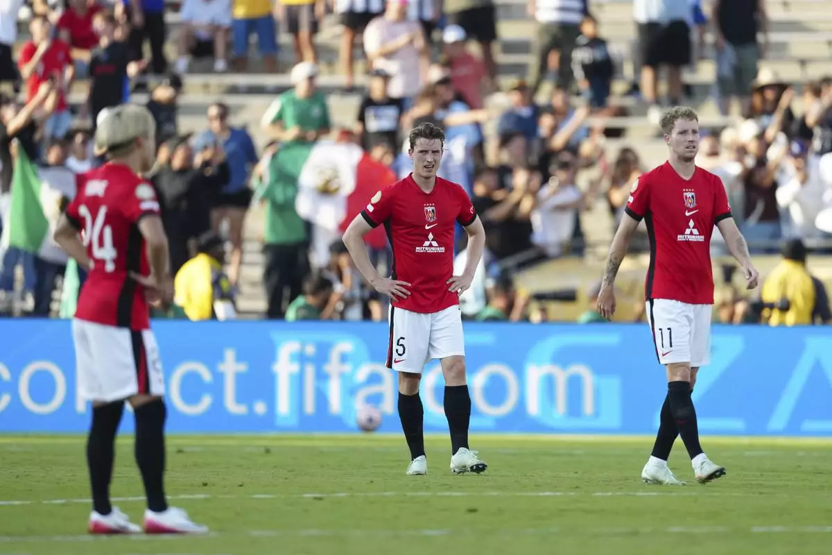 Urawa Red Diamonds' players react after a goal of Monterrey's Jesus Manuel Corona uring the Club World Cup Group E soccer match between Urawa Red Diamonds and CF Monterrey in Pasadena, Calif., Wednesday, June 25, 2025. (AP Photo/Jae Hong)
