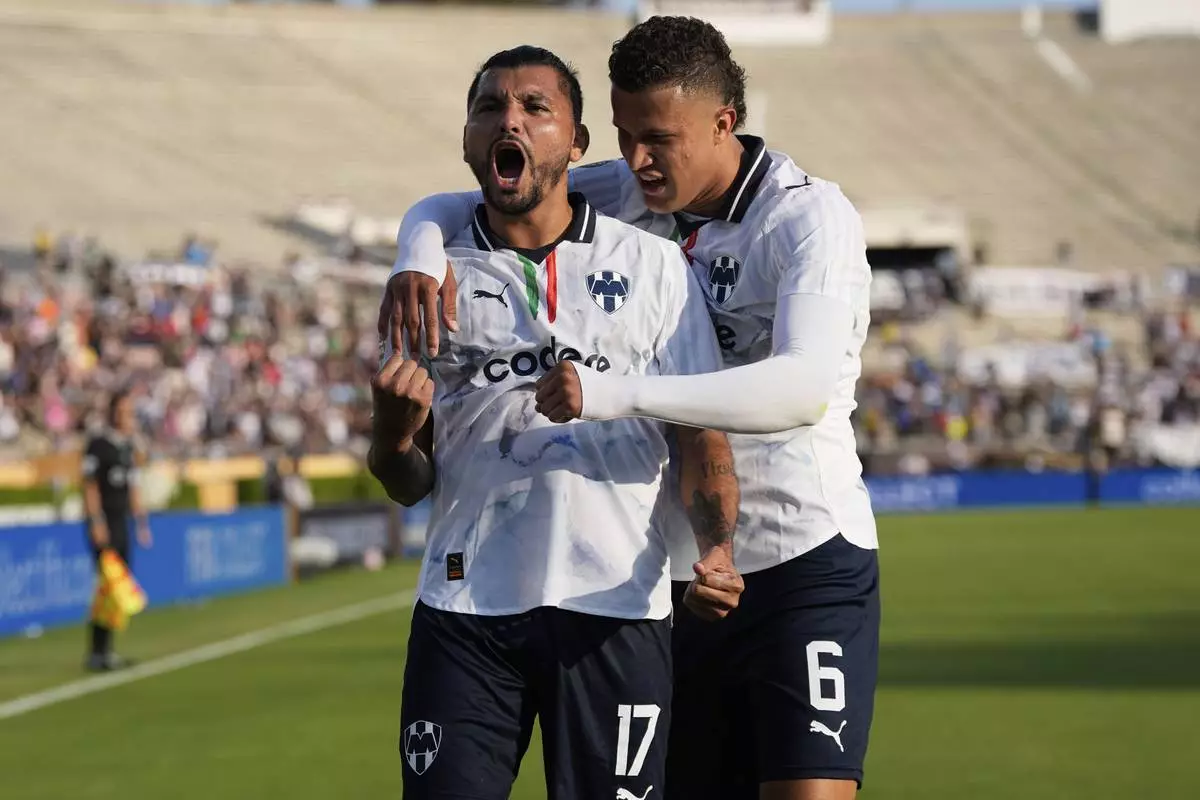 Monterrey's Jesus Manuel Corona celebrates after scoring with Nelson Deossa during the Club World Cup Group E soccer match between Urawa Red Diamonds and CF Monterrey in Pasadena, Calif., Wednesday, June 25, 2025. (AP Photo/Gregory Bull)
