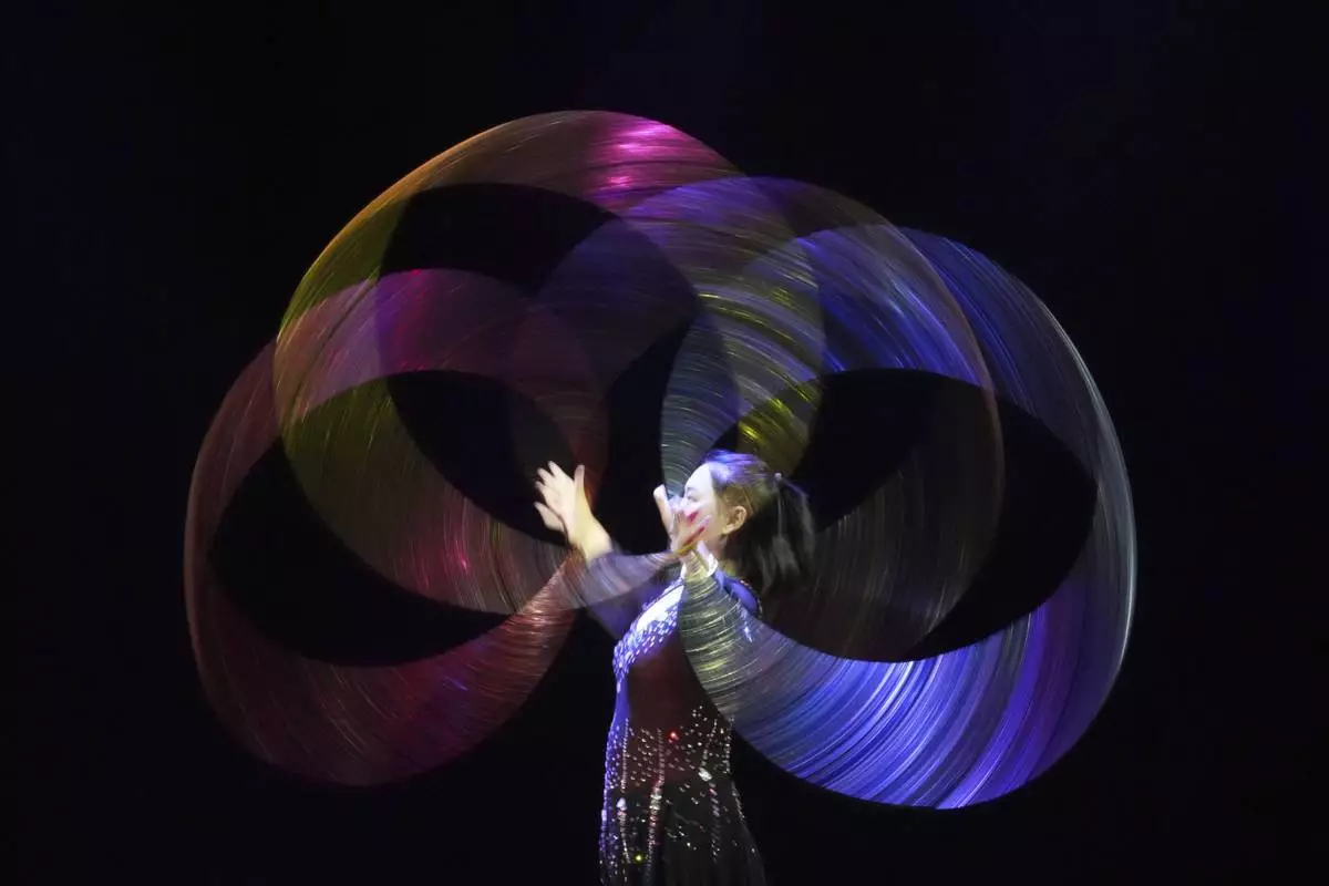 An acrobat from Dongchoon Circus Troupe performs during a daily regular performance in Ansan, South Korea, Wednesday, June 11, 2025. (AP Photo/Lee Jin-man)