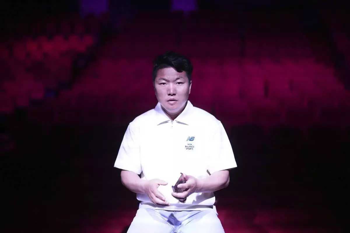 Xing Jiangtao, a 37-year-old Chinese, who has been working for Dongchoon Circus Troupe since 2002, speaks during an interview at the circus' big top in Ansan, South Korea, Tuesday, June 10, 2025. (AP Photo/Lee Jin-man)