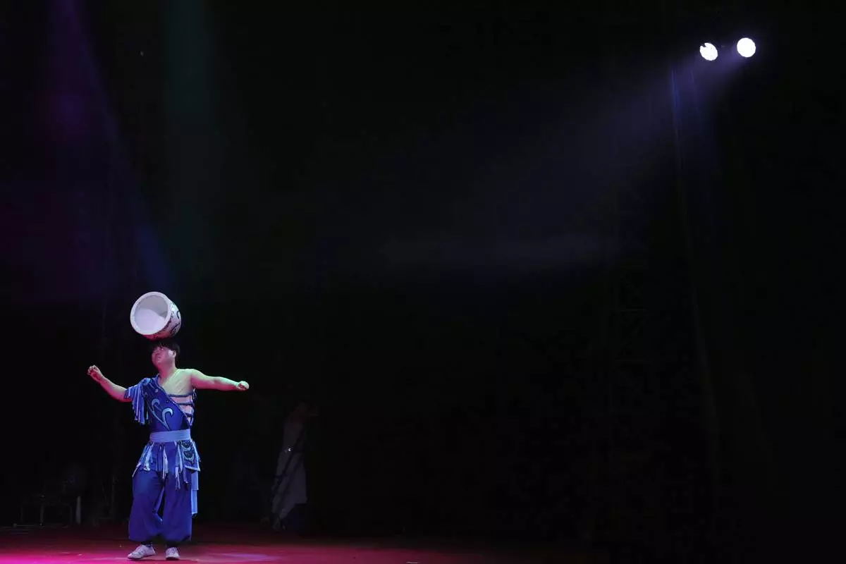 An acrobat from Dongchoon Circus Troupe performs during a daily regular performance in Ansan, South Korea, Tuesday, June 10, 2025. (AP Photo/Lee Jin-man)