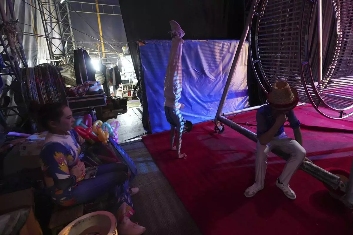 Dongchoon Circus Troupe acrobats warm up ahead of a daily regular performance in Ansan, South Korea, Tuesday, June 10, 2025. (AP Photo/Lee Jin-man)