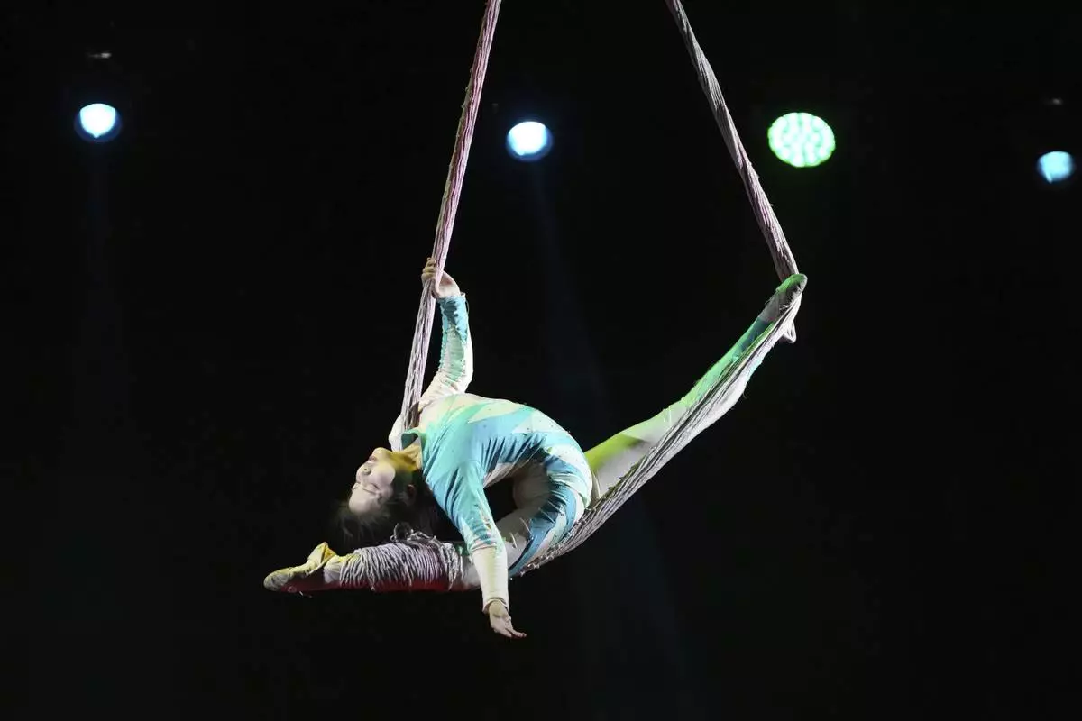 An acrobat from Dongchoon Circus Troupe which South Korea's last-remaining circus, performs during a daily regular performance in Ansan, South Korea, Wednesday, June 11, 2025. (AP Photo/Lee Jin-man)
