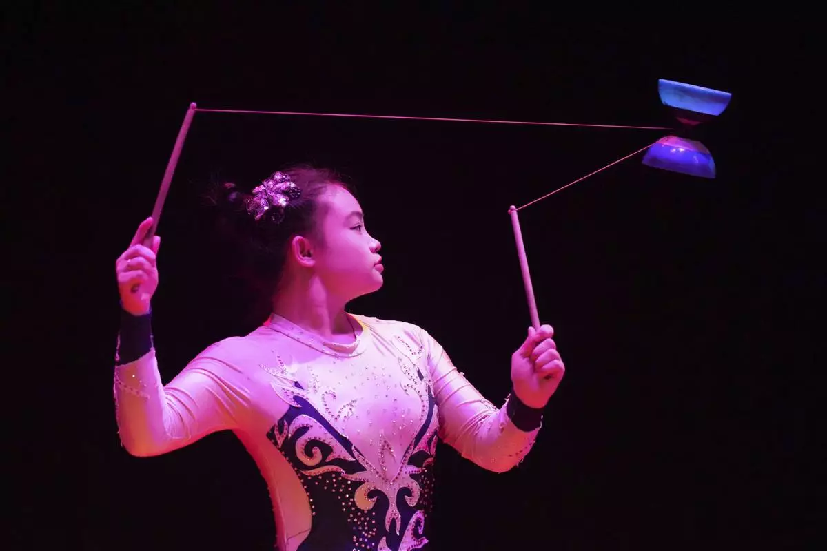An acrobat from Dongchoon Circus Troupe performs during a daily regular performance in Ansan, South Korea, Wednesday, June 11, 2025. (AP Photo/Lee Jin-man)