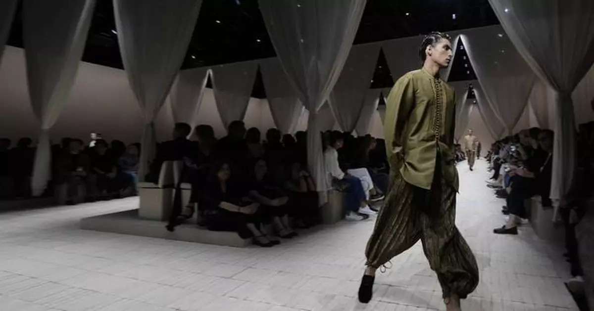 Armani's global aesthetic shines in bohemian Emporio Armani show, though designer misses Milan bow